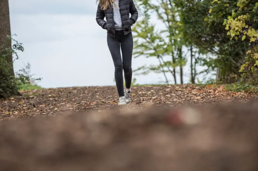 Girl hiking wearing a down coat