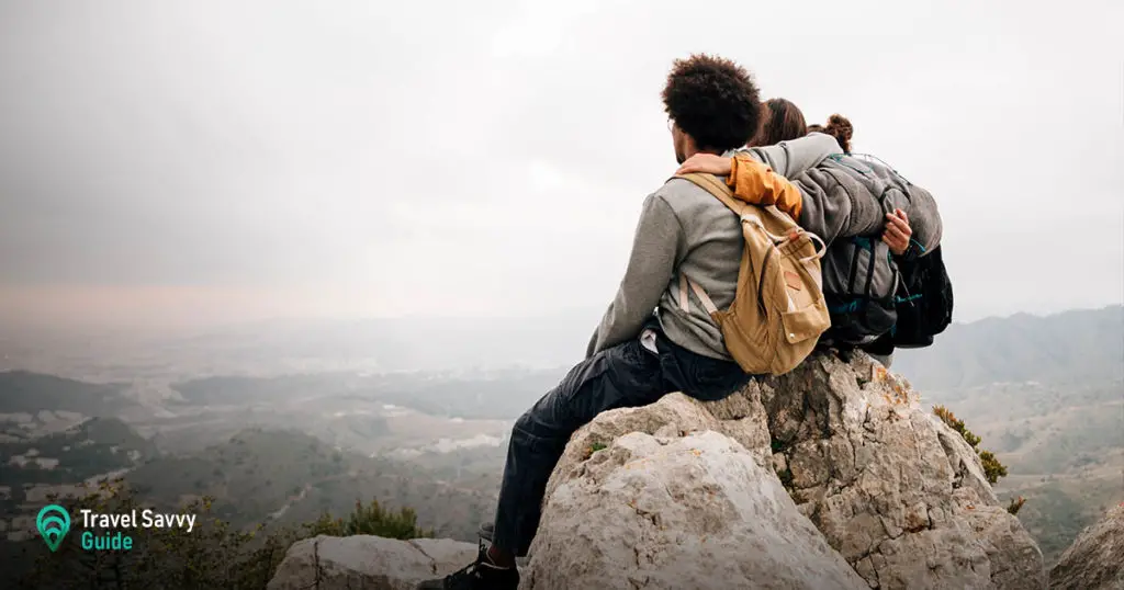 3 people on a cliff