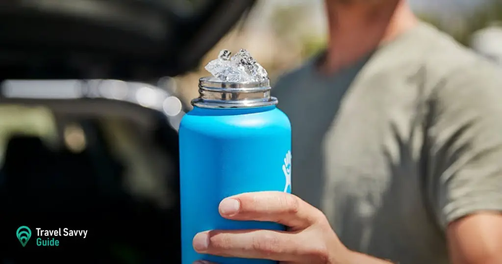 A person holding a Hydro Flask filled with ice