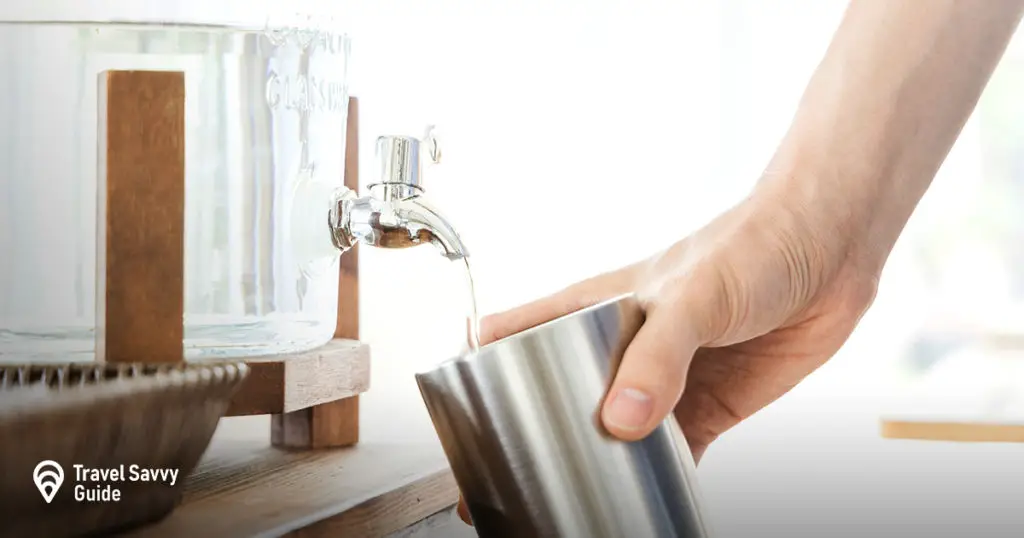 woman filling a flask with water