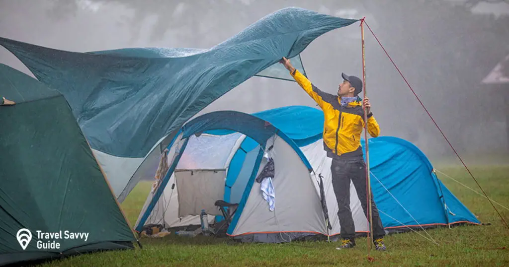 Travelers are repairing tents during the rainy