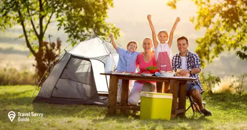 happy family on camping at sunset