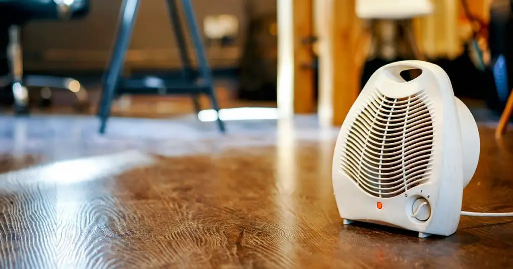 Portable air heater on the floor