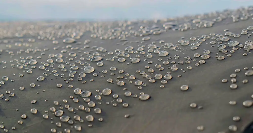 Rain drops on brown tourist tent