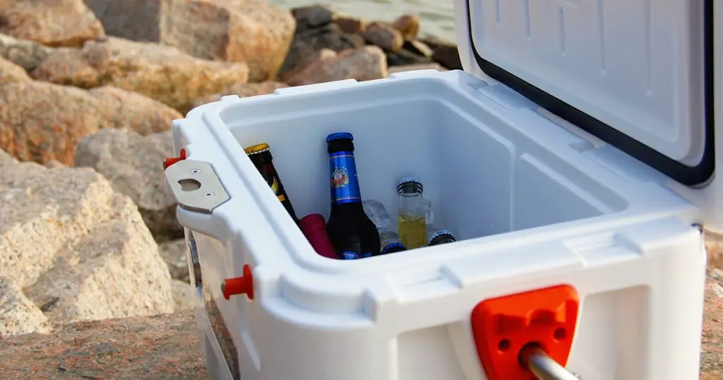 White hard cooler on the beach