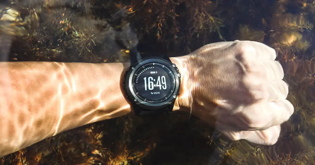 Waterproof sport watches underwater on hand