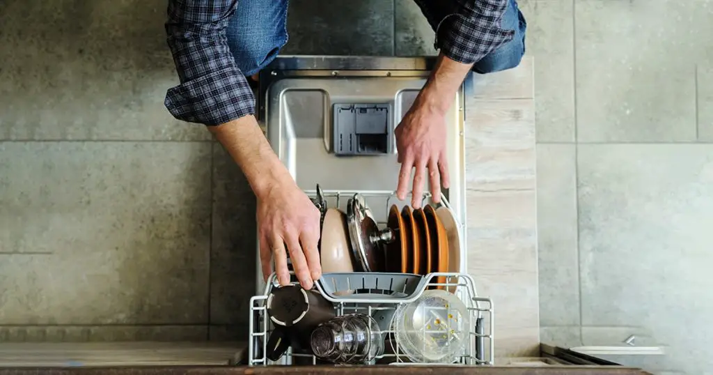 Man using dishwasher