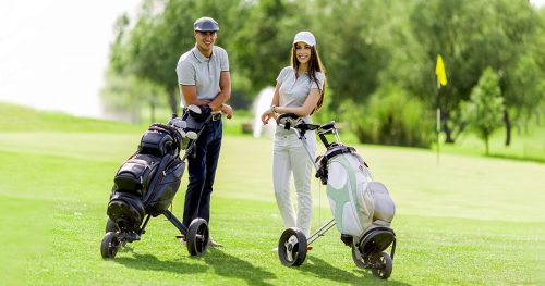 Young couple playing golf