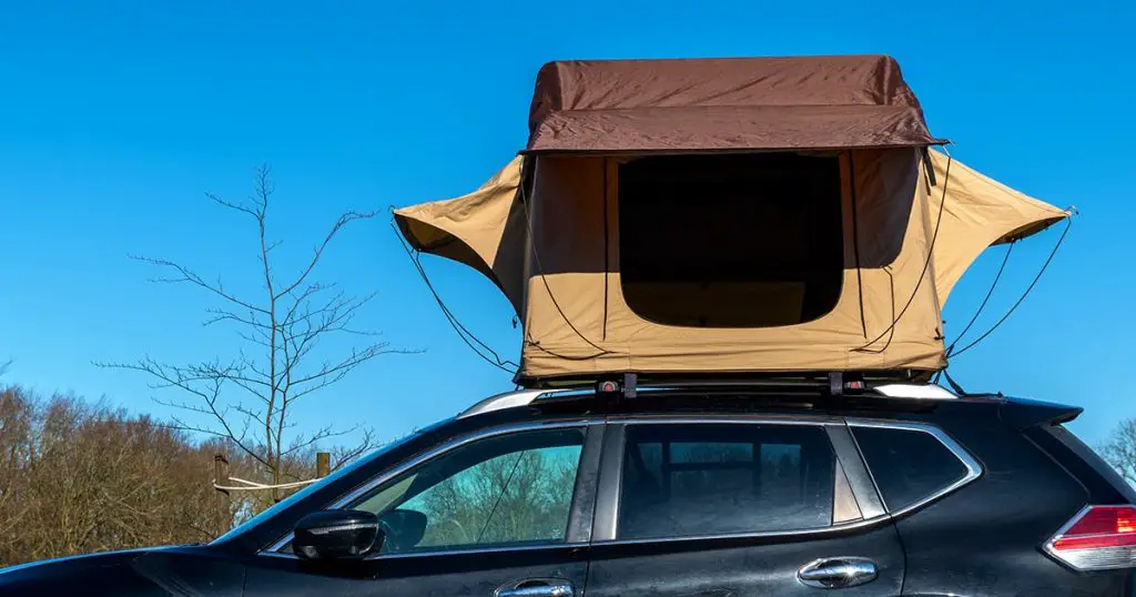 Excursion or overlanding with a Roof top tent on a regular car in a sunny spring
