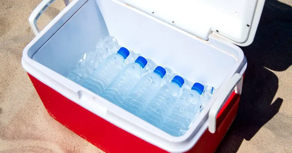 water bottles in a cooler with ice