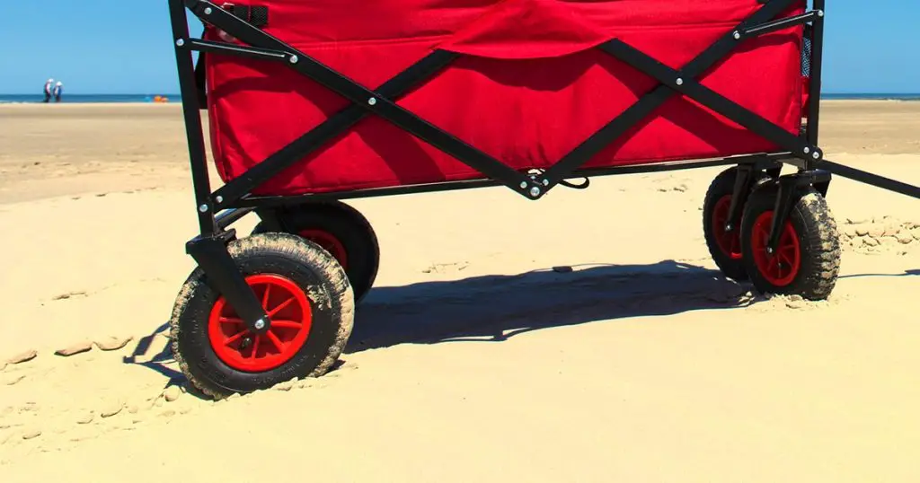 Wheels of a red beach cart