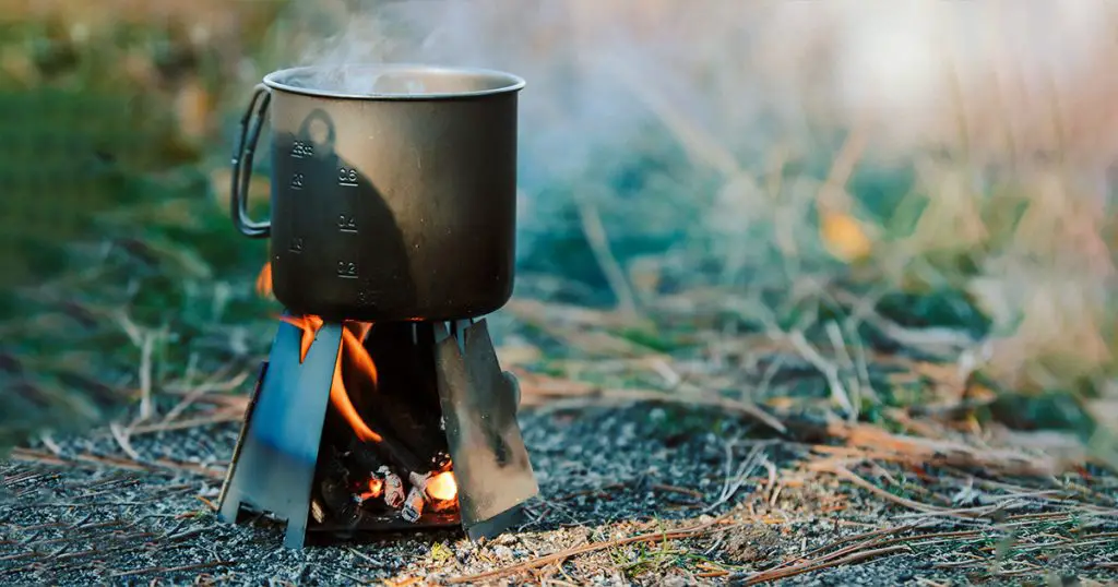 Steaming mug on folding wood stove