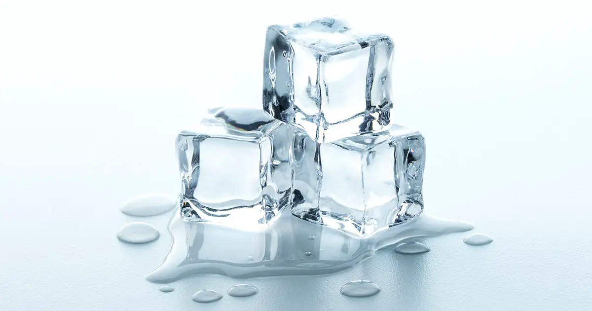 Melting Ice cubes with water drops on a table