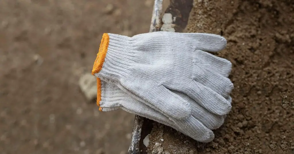 White fabric gloves on background