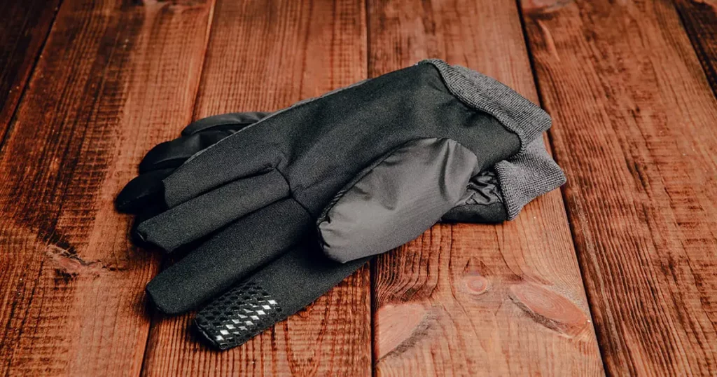 Winter gloves on wooden table