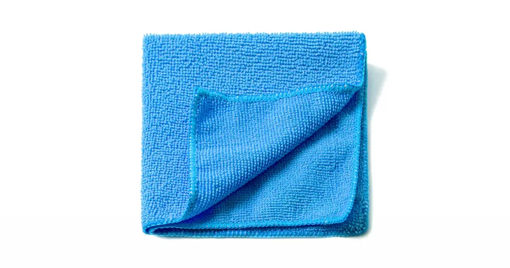 Blue universal microfiber cloth for cleaning objects and surfaces on a white background