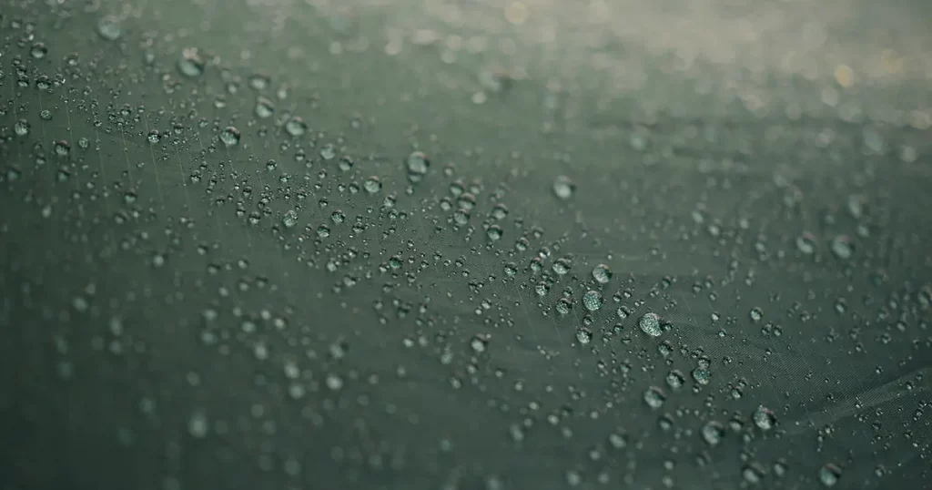 drops of water on the canvas of a tourist tent