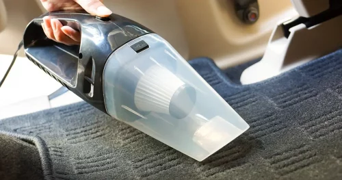 Cleaning a car using a vacuum cleaner