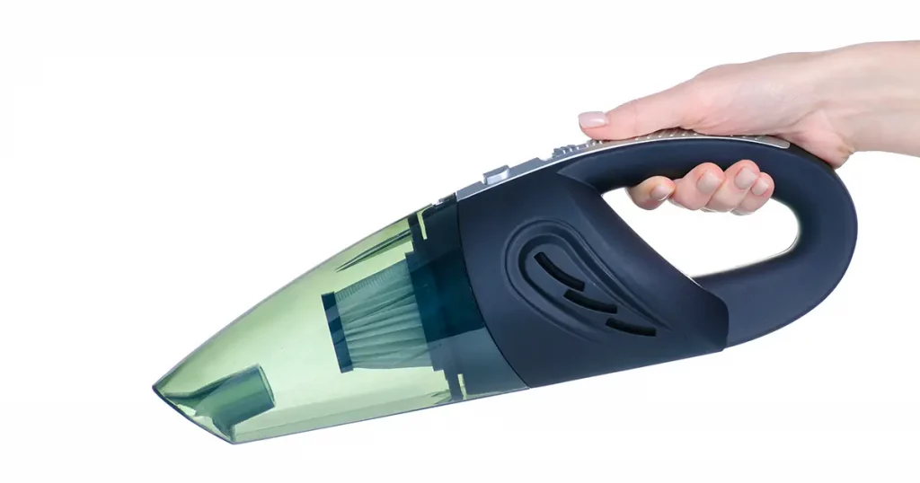 car vacuum cleaner in hand on white background isolation