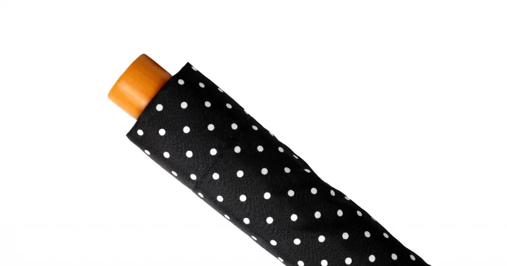 polka dot umbrella folded cover isolated on white background