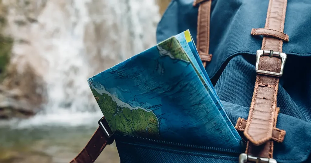 hipster-blue-backpack-map-closeup-view
