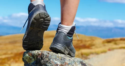hiking boots on the rock in the mountains