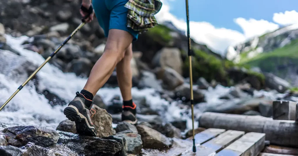 woman-wearing-outdoor-boots-shorts-walking