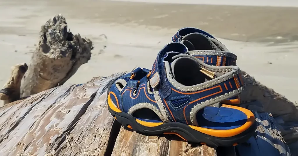 blue and orange sandals on the beach