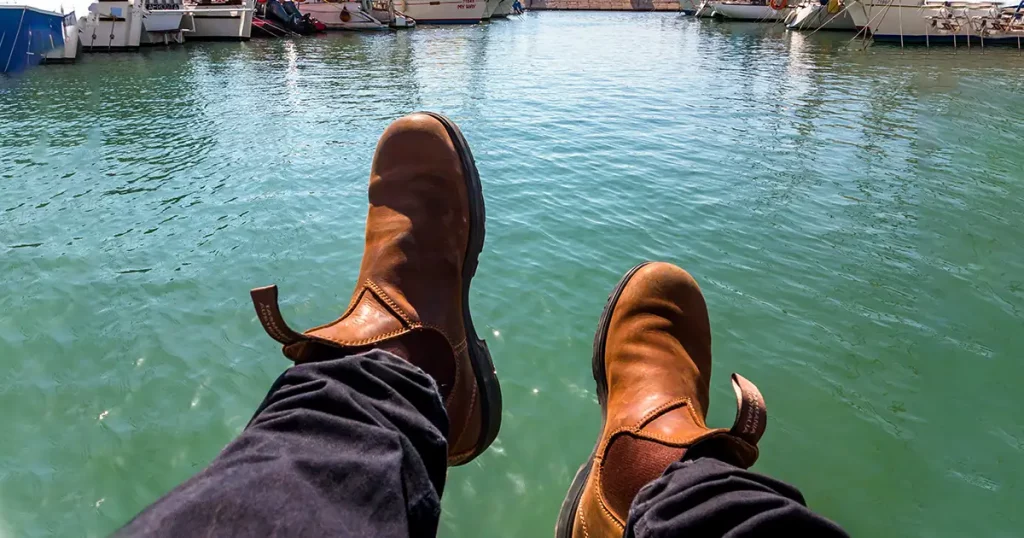 Blundstone shoes against the backdrop of the port of Jaffa