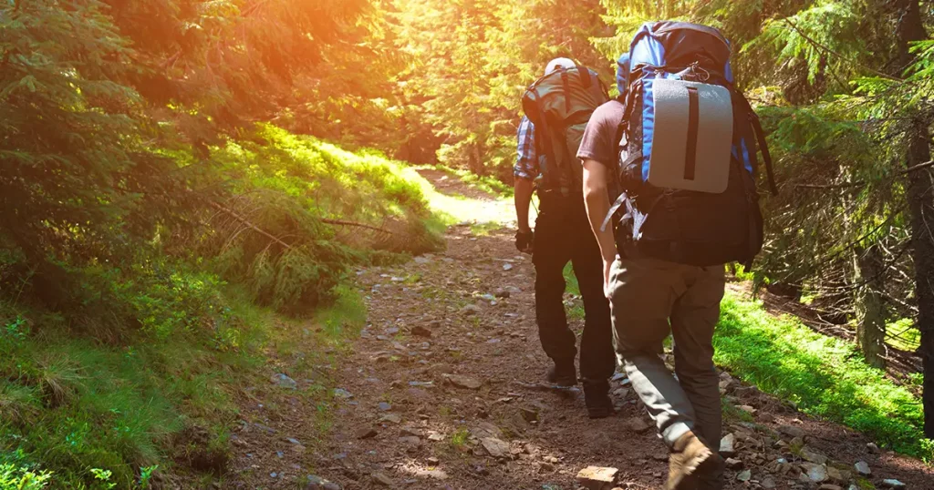 two-friends-travel-mountains-backpacks