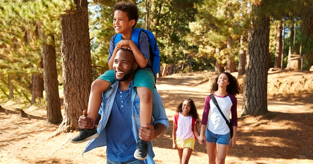 family-on-hiking-adventure-through-forest