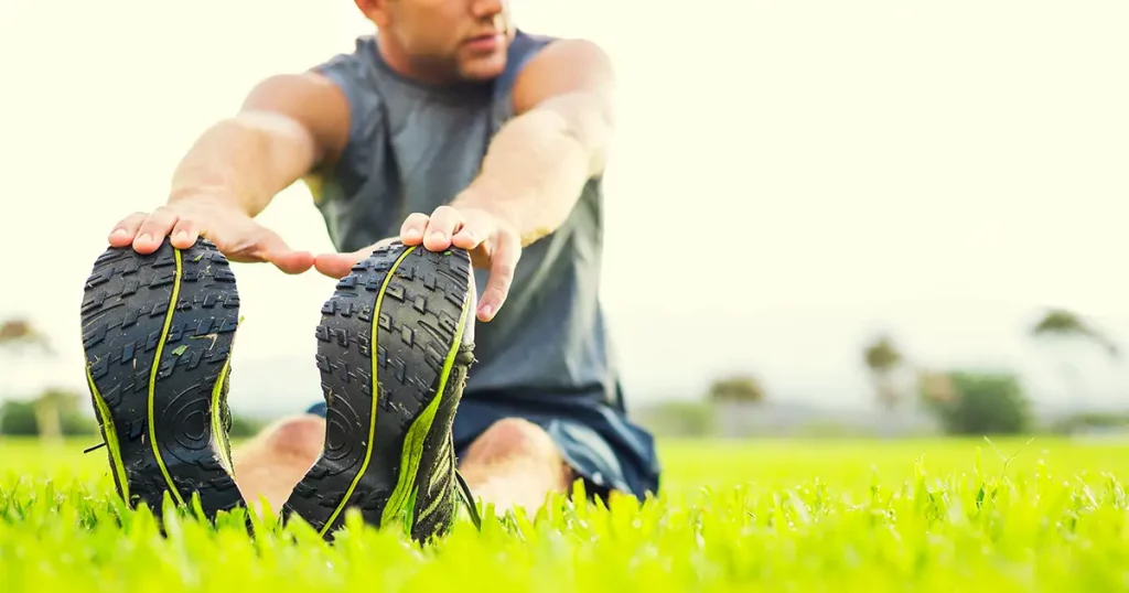 attractive-fit-young-man-stretching-before