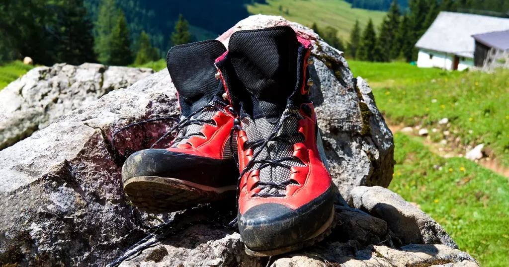 red hiking boots on a hike in the mountains of austria. activity during leisure time