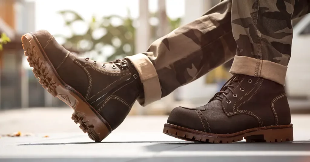 Fashion men's legs in army pants and brown boots zipper for man collection.