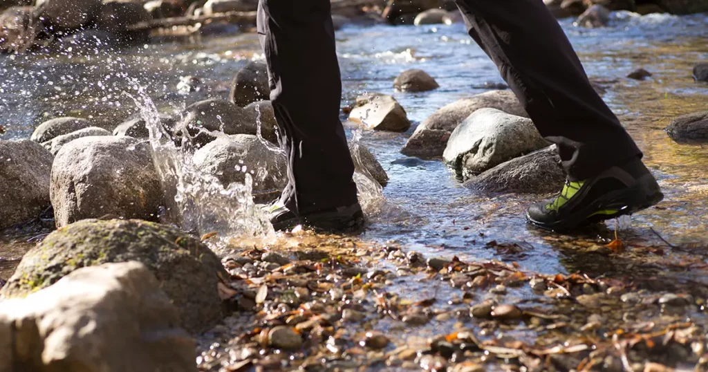 feet walking on the river