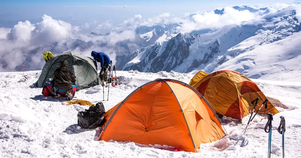 Mountaineers and tents at camp 3 of Lenin peak