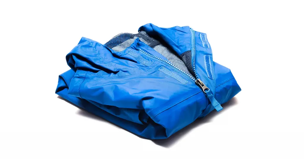 folded blue zipper windbreaker jacket rain