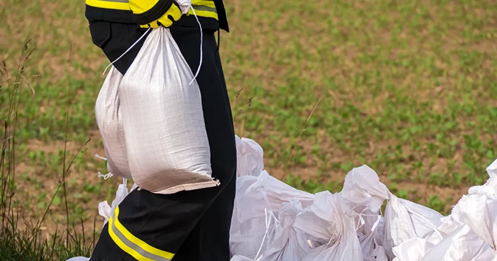 Firefighter with sandbags