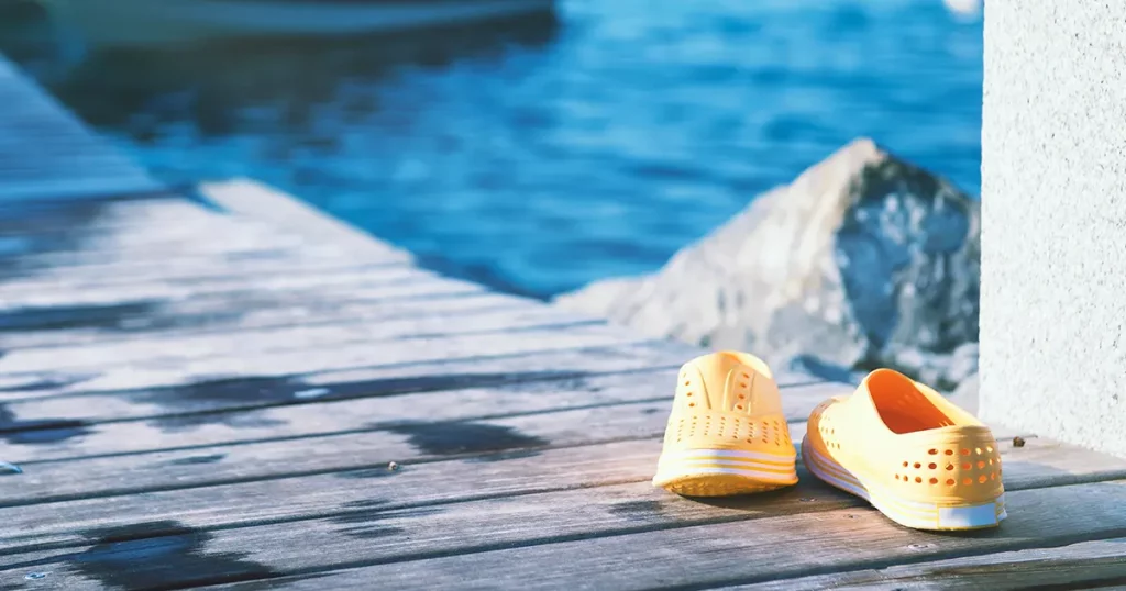 Shoes on a pier - let's swim