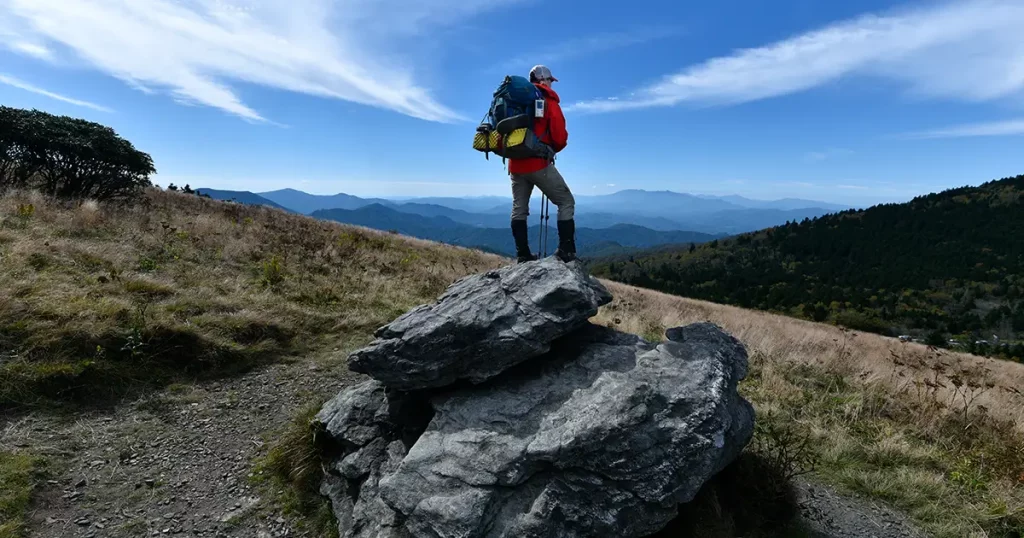 Backpacker in Red looking over the Appalachian trail