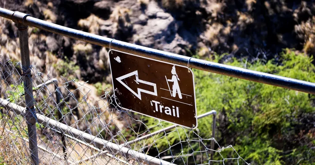 Hiking trail marker inside Diamond Head crater on Oahu, Hawaii.