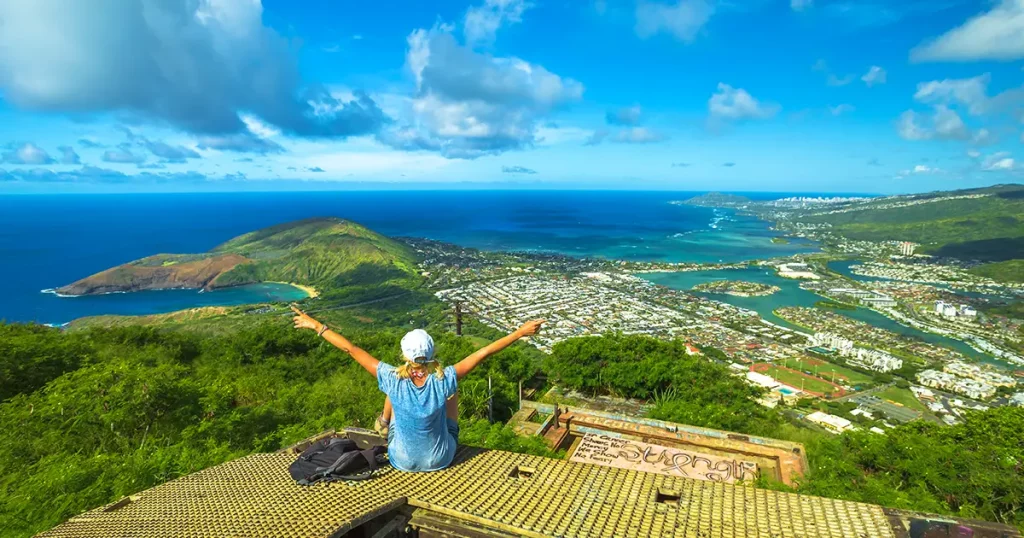 waiian hiking in nature scenic landscape.Female hiker with raised arms