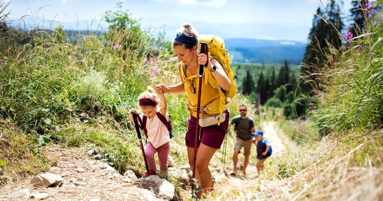 family-small-children-hiking-outdoors-summer
