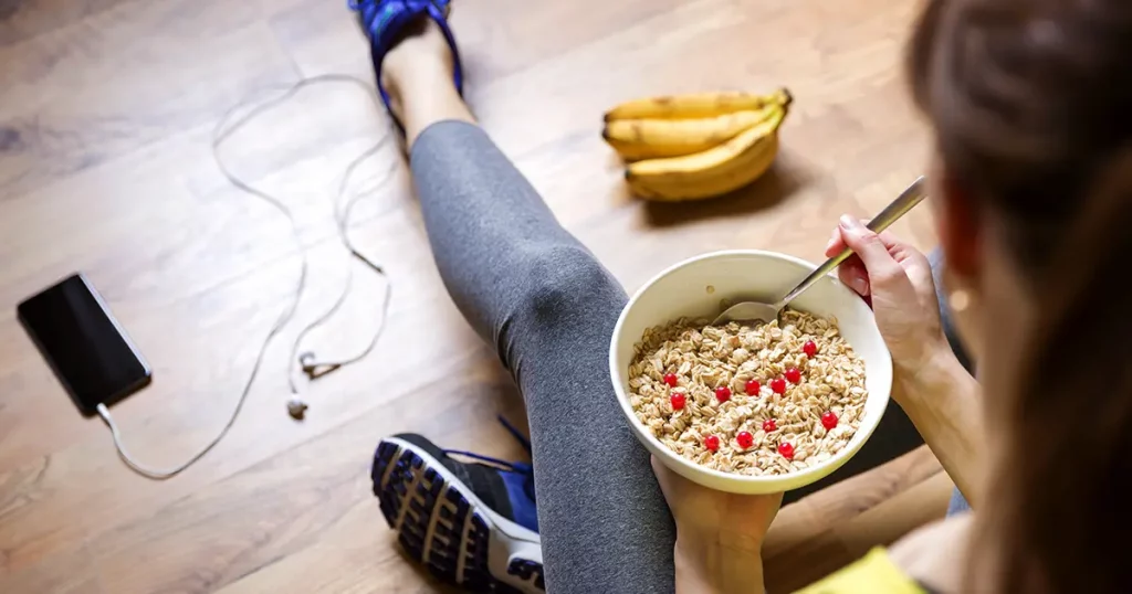 young-girl-eating-oatmeal-berries-after