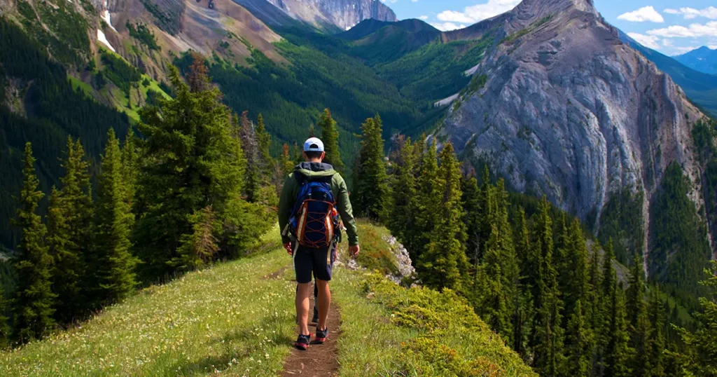 healthy-young-man-woman-hiking-enjoying