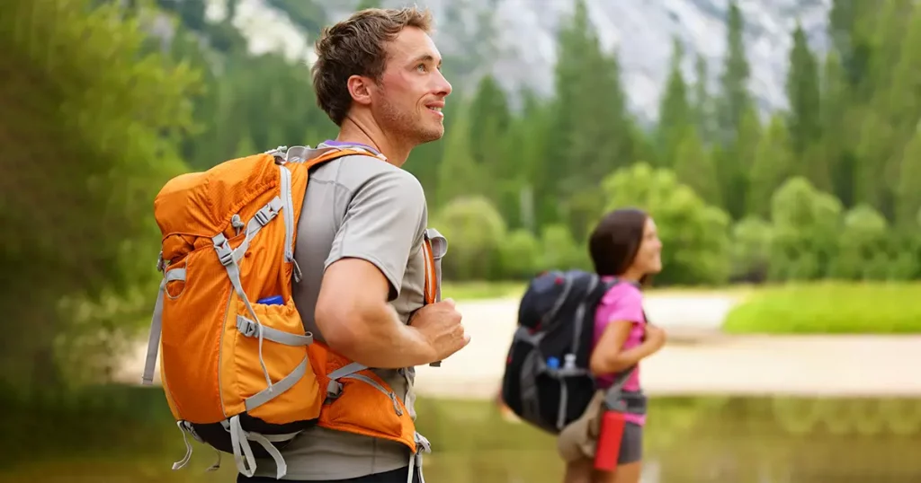 hikers-people-hiking-man-looking-mountain