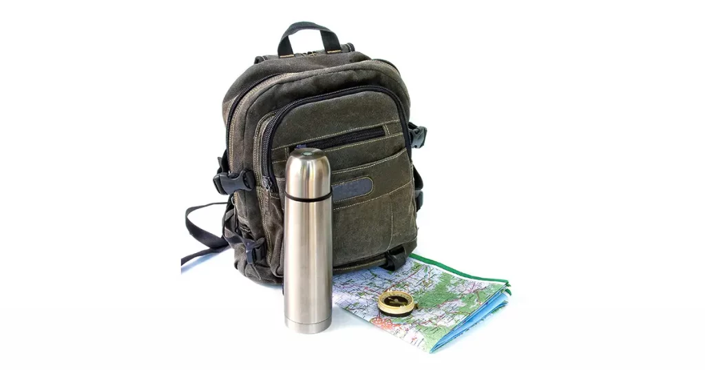 knapsack with thermos on white background