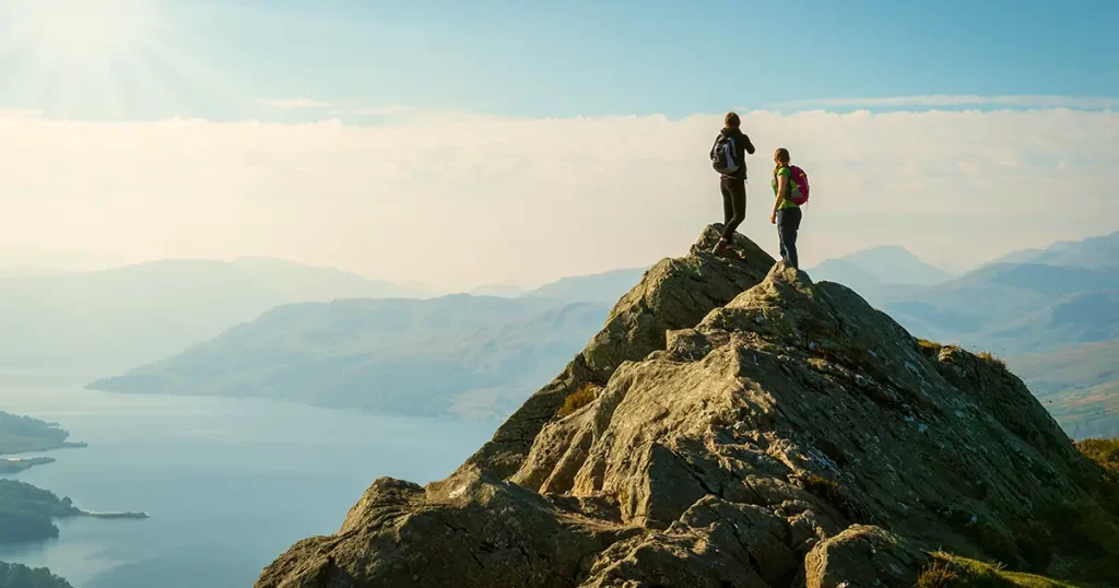 two-female-hikers-on-top-mountain