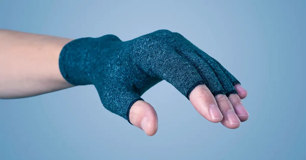 closeup of a caucasian man wearing a compression glove