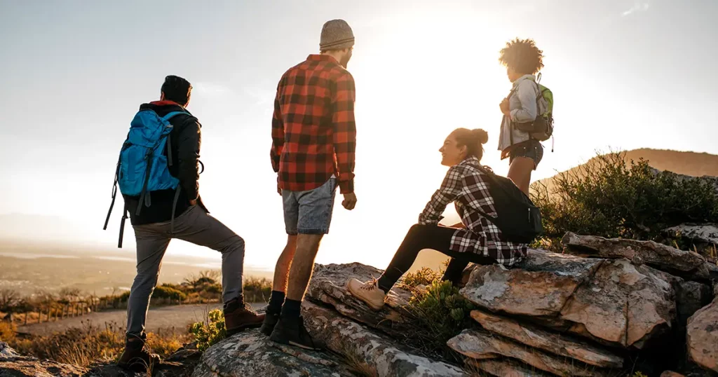 group-hikers-on-top-hill-enjoying